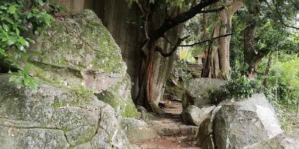 The temple lies at the foot of a huge boulder